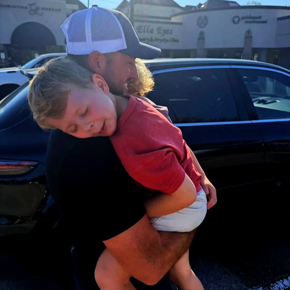 Michael carrying his son